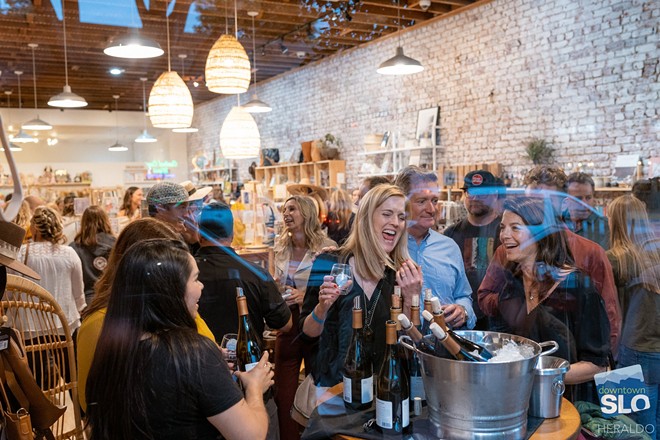 Guests sample wine at retail location in downtown San Luis Obispo
