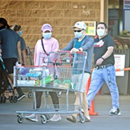 Grocery store employees are left with the responsibility of enforcing face-covering mandates