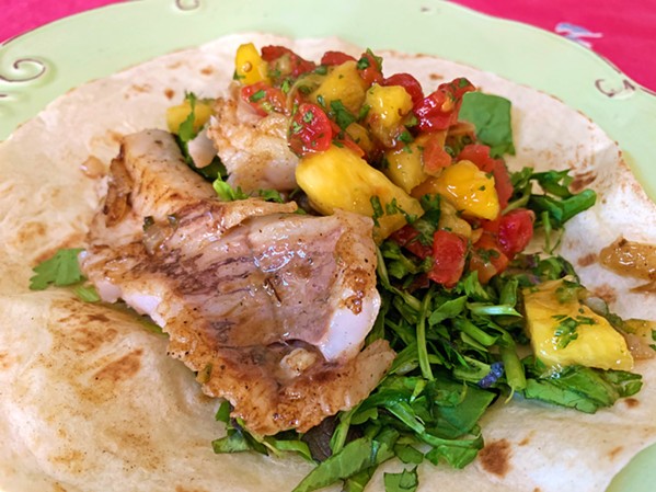 READY FOR DINNER For a quick meal after a long day out on the water, tortillas wrap up grilled fresh rockfish, a tropical salsa, and cilantro salad. - PHOTO BY CAMILLIA LANHAM