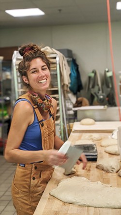 BREAD MAGIC Mariah Grady, co-owner of Bread Bike (seen here before she shaved her head), is all about creating magic. The SLO native never tires of baking (and sampling) every loaf that comes out of the oven. - PHOTOS COURTESY OF PRESTON RICHARDSON