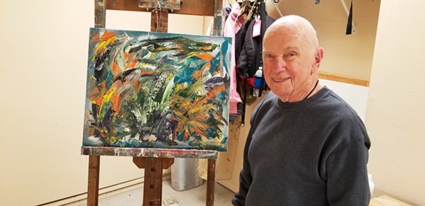 GOING STRONG AT 93 Morro Bay author and artist Marvin Sosna, whose work is at the Cambria Center for the Arts this month, stands before "Rising Tides," which he says "refers to Black Lives Matter, LGBTQ, the calls for justice and equality&mdash;a tsunami of long-restrained demand for action." - PHOTO COURTESY OF MARVIN SOSNA