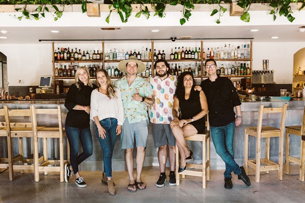TIGHT-KNIT Opened by a group of friends, The Alchemists' Garden team is close and collaborative. From left to right: Chef Danelle Jarzynski; co-owners Quin Cody, Tony Bennett, Andrew Brune, Alexandra Pellot; and Travis Hallanan. - COURTESY PHOTO BY SARAH KATHLEEN PHOTOGRAPHY