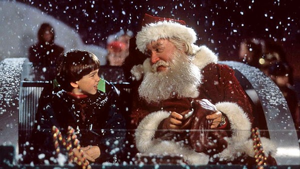 SANTA'S SLAYER Scott Calvin (Tim Allen, right) takes his son, Charlie (Eric Lloyd, left), out for a sleigh ride, roughly one year after they witnessed Santa Claus die in front of them, in Disney's The Santa Clause. - PHOTO COURTESY OF DISNEY
