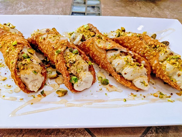 DELICIOUS Although fried cannoli isn't traditionally Persian, the Middle Eastern flavors of the ice cream Shekamoo Grill squeezes inside them go perfectly with the crunchy shell, pistachios, and honey. - PHOTOS COURTESY OF SINA SHAKERIAN