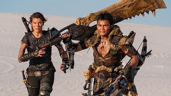 MONSTER MASH After being transported to a hidden realm, Capt. Artemis (Milla Jovovich, left) teams with Hunter (Tony Jaa) to fight giant monsters, in the video game adaptation Monster Hunter, available at Redbox. - PHOTO COURTESY OF CONSTANTIN FILM