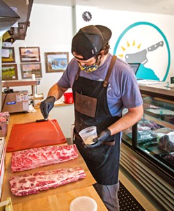 SEASONED Butcher Geoff Montgomery gets tri-tip ready for roasting at Morro Bay's new butcher shop. - PHOTOS BY JAYSON MELLOM