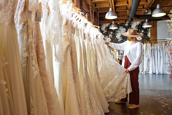 DREAM DRESS Moondance Bridal Manager Olivia Pereira can help brides-to-be with tough decisions about length, cut, material, fit, and more at the Best Bridal Shop, located on Santa Barbara Avenue in San Luis Obispo. - PHOTO BY JAYSON MELLOM