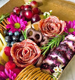 STOP AND EAT THE ROSES One staple feature of boxes and boards at Brie Happy Charcuterie is founder Rachel Boston's salami roses. "You can't help but smile when looking at a gorgeous rose that you can also eat," Boston said. "Appearance is such an important factor. I truly feel like we eat with our eyes first." - PHOTOS COURTESY OF RACHEL BOSTON