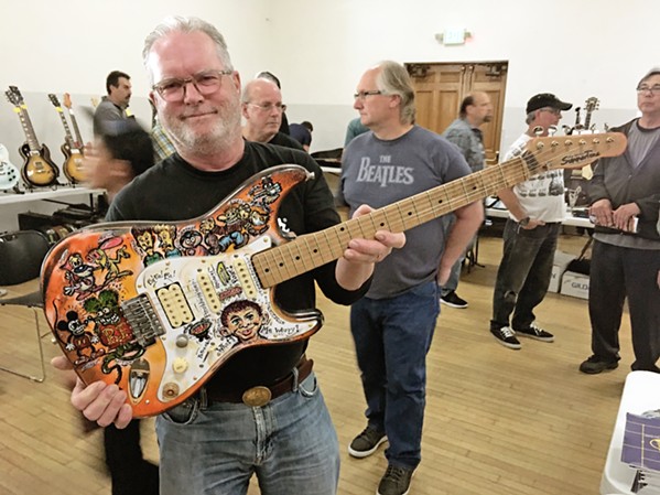 CALLING ALL GUITARISTAS Local musician John Summers shows off his hand-painted Stratocaster at a past Central Coast Guitar Show, which returns on Aug. 7 at the SLO Guild Hall. - PHOTO COURTESY OF THE CENTRAL COAST GUITAR SHOW