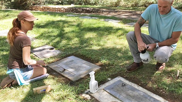 CLEANING WITH MEANING Loshel and Lisa Robinson have been maintaining graves since July; but they've been together for 11 years and married since 2015. - COURTESY PHOTO OF LISA ROBINSON