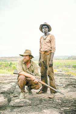 MORAL QUANDARY Travis (Simon Baker, left) and Gutjuk (Jacob Junior Nayinggul) team up to hunt down Gutjuk’s uncle, who’s leading a mob that’s attacking white settlements in early 1930s Australian outback, in High Ground, screening on Hulu. - PHOTO COURTESY OF MAXO, BUNYA PRODUCTIUONS, AND SAVAGE