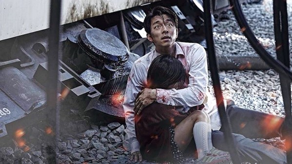 FATHERHOOD A workaholic father, Seok-woo (Gong Yoo), must protect his young daughter, Soo-an (Su-an Kim), from a zombie outbreak while confined to a train, in the 2016 Korean film Train to Busan, currently screening on Amazon Prime. - PHOTO COURTESY OF NEXT ENTERTAINMENT WORLD
