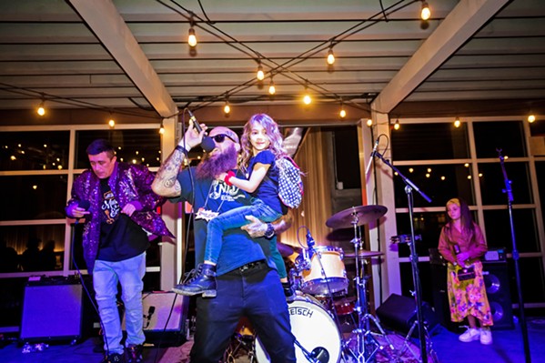 IT'S A FAMILY AFFAIR Hip-Hop/Rap winner Rogue Status and its frontman RoAch Clip brought kids to the stage as they were laying down beats and spitting out rhymes. - PHOTO BY JAYSON MELLOM