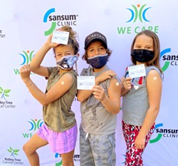 ALL SMILES Kids in the 5 to 11 age group show off their bandaged arms after getting the COVID-19 vaccine at a Nov. 17 Sansum Clinic child vaccine event. - PHOTO COURTESY OF SANSUM CLINIC