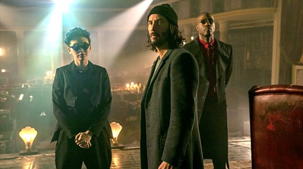 WELCOME BACK New and old allies initiate the "resurrection" of Neo (Keanu Reeves), who has forgotten the events of the original Matrix trilogy and has become a successful video game developer, in The Matrix Resurrections. - PHOTO COURTESY OF WARNER BROS.