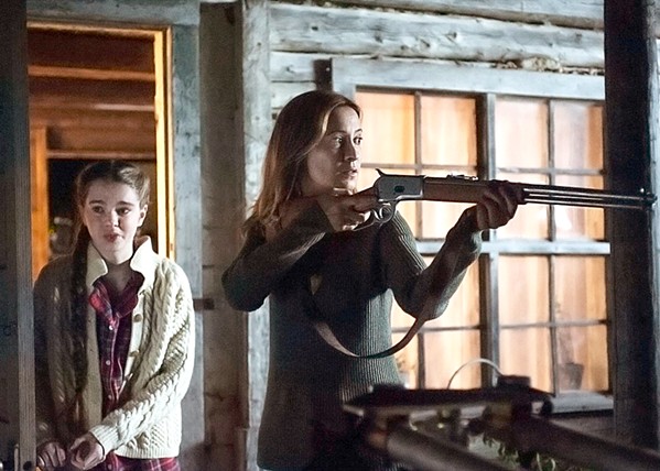 STALKER Anne (Camille Sullivan, right) and her young daughter, Ren&eacute;e (Summer H. Howell), are being stalked by a wolf and encountered a wounded stranger, in Hunter Hunter, currently streaming on various platforms. It's free with a Hulu subscription. - PHOTO COURTESY OF JULIJETTE AND MARVISTA ENTERTAINMENT