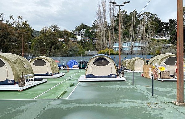 SANCTIONED Last year, the city of Sausalito opened a sanctioned homeless encampment after a lawsuit filed by homeless advocates forced its hand. The camp, located on city tennis courts, houses more than two dozen people, but a recent tent fire and explosion raised concerns. - PHOTO COURTESY OF THE CITY OF SAUSALITO
