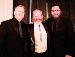 INCLUSIVE LEADER Dusty Colyer-Worth (center), president of the GALA Pride and Diversity Center, is a community leader on diversity, equity, and inclusion. He’s pictured here with his husband David Worth (left), and their partner James Upton. - PHOTO COURTESY OF DUSTY COLYER-WORTH