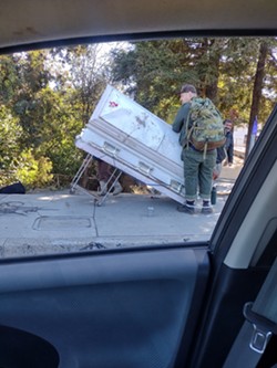 GROWING PROBLEM Commuters and law enforcement officials across the city of SLO spotted a homeless woman pushing an abandoned coffin down the street, with one eyewitness suspecting she sleeps in it. - PHOTO BY S. HARRIS