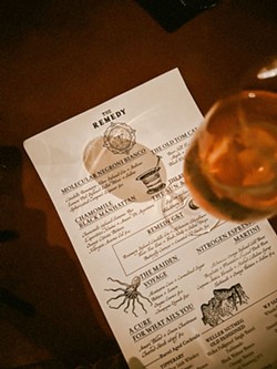 SCROLL AWAY Laced with Old World charm, The Remedy's dark academia style seeps into its menu, too, as guests get to scan drink options from a rolled scroll tied with a black ribbon. - PHOTOS COURTESY OF QUIN CODY