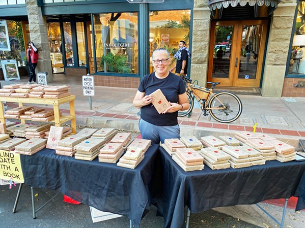 READING IS FUN Last year, Sandra Hardridge embarked on a journey to encourage others to enjoy reading as much as she does by founding Blind Date with a Bookk, selling wrapped books at the SLO farmers' market. - PHOTO COURTESY OF TREY HARDRIDGE