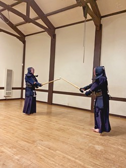 KIAI! Students at Central Coast Aikido Kendo square off in a practice sparring match. Carter says that anyone from the ages of 5 years to 65 and older can join Kendo. - PHOTO COURTESY OF JASON CARTER