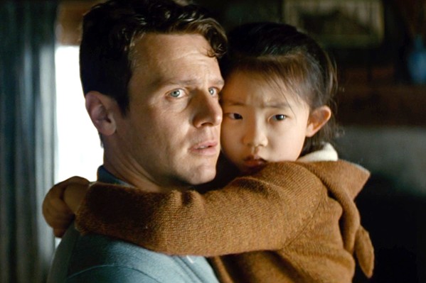 CHOOSE A family&mdash;including father, Eric (Jonathan Groff), and daughter, Wen (Kristen Cui)&mdash;is held hostage by a group of strangers, who tell them they must sacrifice one member to avert the apocalypse, in M. Night Shyamalan's Knock at the Cabin, screening in local theaters. - PHOTO COURTESY OF UNIVERSAL PICTURES