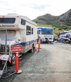 GARAGED RVs and campers populate the parking spaces at SLO County's Oklahoma Avenue safe parking site, which is no longer accepting new program applicants. - PHOTO BY JAYSON MELLOM