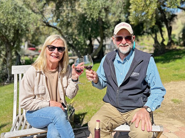 LABOR OF LOVE Paul and Patricia Hoover toast their legacy at Still Waters. You can find the couple at their Paso Robles estate most days, "unless we are spending time with our kids and four grandchildren, or the fish are biting," Paul says. - PHOTO COURTESY OF STILL WATERS VINEYARDS