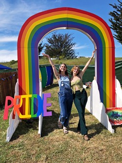A NIGHT TO REMEMBER This rainbow art piece will be set up for students to commemorate the night with by taking photos with it&mdash;like Art and Soul founder Faith LaGrande and vendor Ali Miller-Bean did recently. - COURTESY PHOTO BY ERIC MATTSON