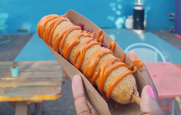 MAINSTAY Babydudes' airy corndog with gochugaru mayo is a fixture on its frequently changing menu. Jacobs and Petschek chose it as an easy yet inspired alternative for gluten-free customers. - PHOTOS BY BULBUL RAJAGOPAL