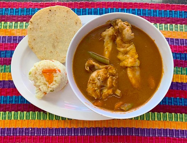 NATION'S PRIDE Azteca Market serves Guatemala's national dish pepi&aacute;n&mdash;chicken stewed in red sauce&mdash;throughout the year. It comes with white rice, steamed vegetables, and tortillas. - PHOTO COURTESY OF AZTECA MARKET