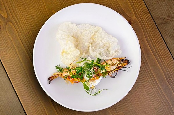 ASIAN INFLUENCE Benavidez loves cooking elevated versions of the Latin American food she grew up eating but also favors Asian-style fare like this grilled curry marinated shrimp with puffed rice paper and micro greens. - PHOTOS COURTESY OF DOMINIQUE BENAVIDEZ