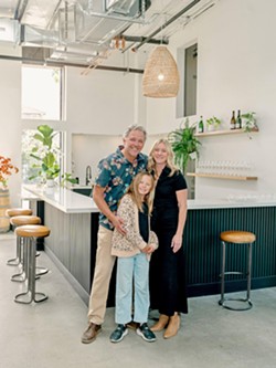 THE PLACE El Lugar owners Coby Parker-Garcia, wife Katie Noonan, and their daughter, Callie, 10, opened their new tasting room and production facility at SLO's Duncan Alley in November. - COURTESY PHOTO BY ASHLEY LUDAESCHER
