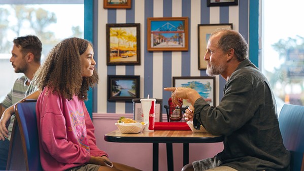 SHARED GRIEF Doris (Nico Parker) and Paul (Woody Harrelson) strike up a friendship as she watches over her dying brother and he protests the feeding tube removal in the Terri Schiavo case, in Suncoast, streaming in Hulu. - COURTESY PHOTO BY ERIC ZACHANOWICH/SEARCHLIGHT PICTURES