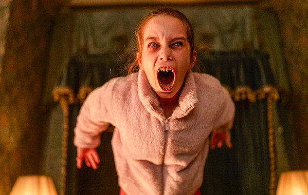 WHAT BIG TEETH YOU HAVE Kidnapped Abigail (Alisha Weir) turns out to be more dangerous than expected for the group of criminals now trapped in a mansion with her, in Abigail, screening in local theaters. - COURTESY PHOTO BY BERNARD WALSH/UNIVERSAL PICTURES