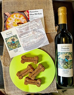 MORE THAN OIL Purposeful Olive Oil handed out recipe cards (available on its website) and free peanut butter and pumpkin dog treats to those who bought bottles of olive oil at the SLO Public Market grand opening of Bishop's Market. - PHOTOS COURTESY OF LAURIE SANCES
