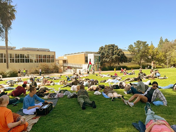 DIE-IN On May 9, around 200 Cal Poly students and faculty participated in a "die-In" where participates laid down on Dexter Lawn for 30 minutes in total silence in honor of those who have been killed in Gaza during the ongoing Israel-Gaza conflict. - PHOTO BY SAMANTHA HERRERA