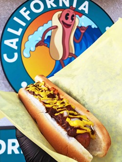 SEMINAL CONDIMENTS Chili, onions, mustard, and more are among the topping selections at California Hot Dogs, through both its long-standing food cart in Avila Beach and new drive-through restaurant in Santa Maria. - PHOTO COURTESY OF CALIFORNIA HOT DOGS