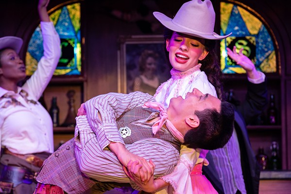 IF THE BOOT FITS The ensemble cast of the Great American Melodrama’s Gunsmokin’, currently on-stage through early September, includes Annaliese Chambers (top) as Rooster Punch resident Virginia and Jeffrey Laughrun (bottom) as Deputy Trusty, who both participates in and narrates the show. - COURTESY PHOTO BY CODY SOPER