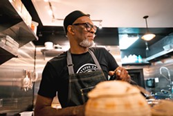 SOUTHERN SOUL Chef Stan Kelly draws culinary inspiration from his Charleston, South Carolina, roots. At his new restaurant, Irie Ites Neighborhood Kitchen in San Luis Obispo, he crafts flavorful cuisine while also nurturing a sense of community. - PHOTO COURTESY OF IRIE ITES NEIGHBORHOOD KITCHEN