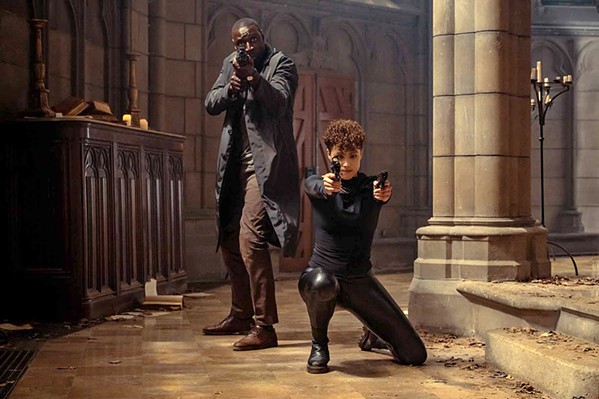 TEAM UP To battle a worse enemy, Paris detective, Sey (Omar Sy), joins forces with Zee (Nathalie Emmanuel), an assassin, in The Killer, streaming on Peacock. - COURTESY PHOTO BY CHRISTINE TAMALET/UNIVERSAL PICTURES