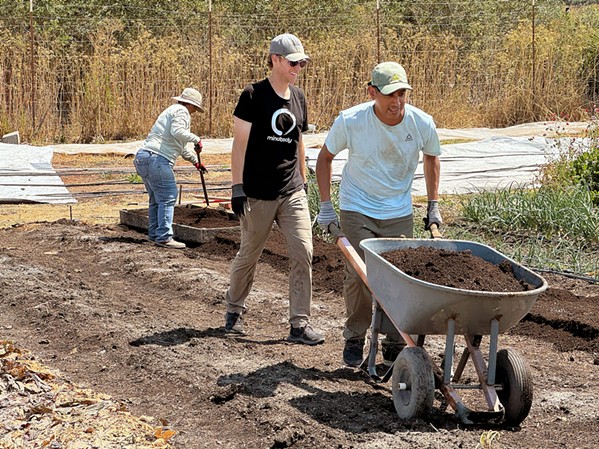 VOLUNTEER-FUELED Firstfruits Farm is 100 percent volunteer-run, including harvest days and works days, such as this one where fresh compost is being added to raised beds. - PHOTO COURTESY OF FIRSTFRUITS FARM