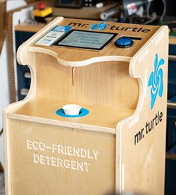 ROLL OUT Sustainable startup Mr. Turtle's refillable laundry detergent station is made of wood and will soon be found at the SLO Food Co-Op and the Laundromat by Swish and Swirl. - PHOTO COURTESY OF BENJAMIN ARTS