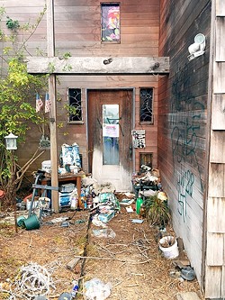 VANDALIZED AND CONDEMNED:  An abandoned Los Osos house vandalized with spray-painted swastikas was condemned by SLO Planning and Building on Sept. 28. - PHOTO BY PETER JOHNSON