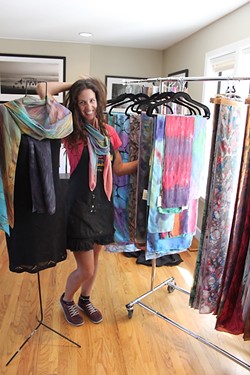 COLOR ME HAPPY :  ColorVibe Design&rsquo;s Sharon Gellerman blends in with her silk scarves on display. - PHOTO BY REBECCA LUCAS