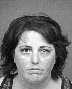 STILL SUPERVISING :  County Mental Health Services employee Kathy Peters was convicted in July of forging a prescription slip in order to obtain Vicodin. The supervisor is now back to her old job after collecting more than $8,700 while on administrative leave. - PHOTO COURTESY OF SLO COUNTY SHERIFF&rsquo;S DEPARTMENT