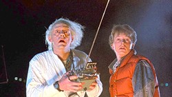 GREAT SCOTT!:  Dr. Emmett Brown (Christopher Lloyd, left) and Marty McFly (Michael J. Fox) work together to send Marty 30 years in the past to make sure his parents meet in high school and fall in love, in Back to the Future. - PHOTO COURTESY OF UNIVERSAL PICTURES AND AMBLIN ENTERTAINMENT