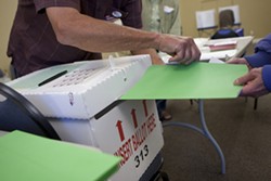 VOTING MYSTERY :  Ballots poured in on election night (pictured), but not everyone&rsquo;s voice was heard this season. An elusive individual linked to a conservative group may be to blame for roughly 900 voter cards turned in late to the SLO County Clerk&rsquo;s Office. - PHOTO BY STEVE E. MILLER