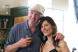 FAST FRIENDS :  Sustenance proprietor Seamus Finn-Chandler and Stacie Benefield, who traveled from Oregon to see the show, cozy up for a photo. - PHOTO BY GLEN STARKEY
